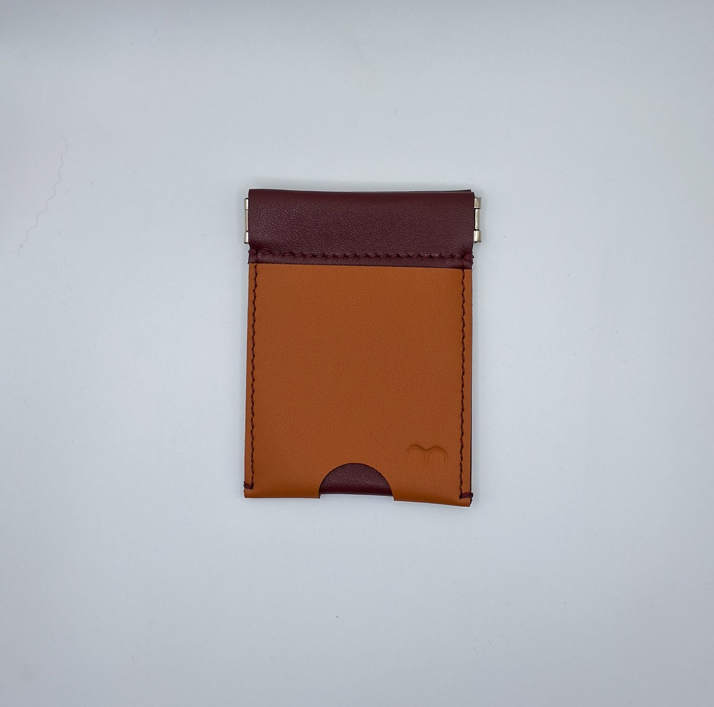 Porte monnzie clic-clac en cuir bordeau et camel